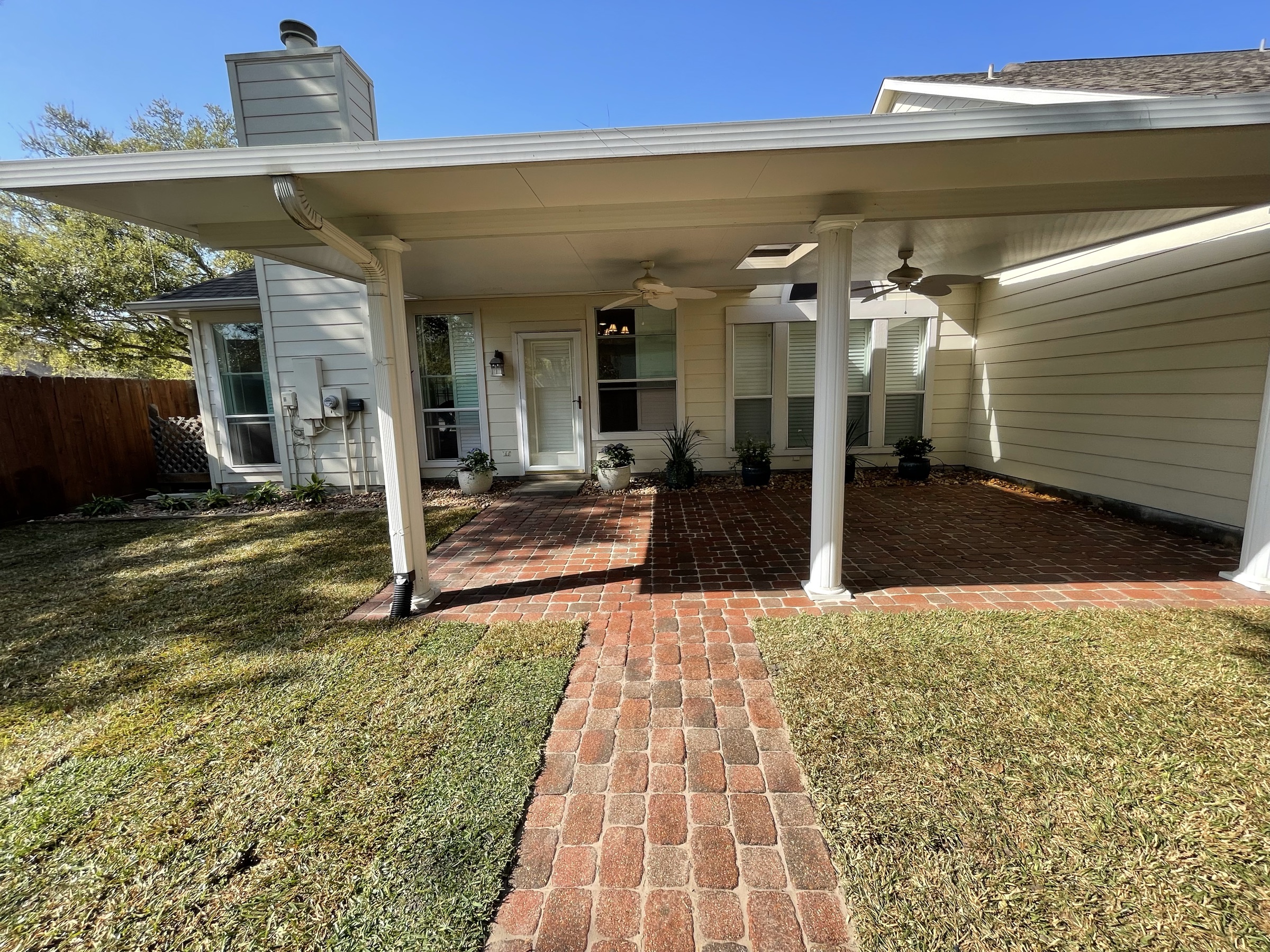 Brick-paver patio and walk on a Houston home