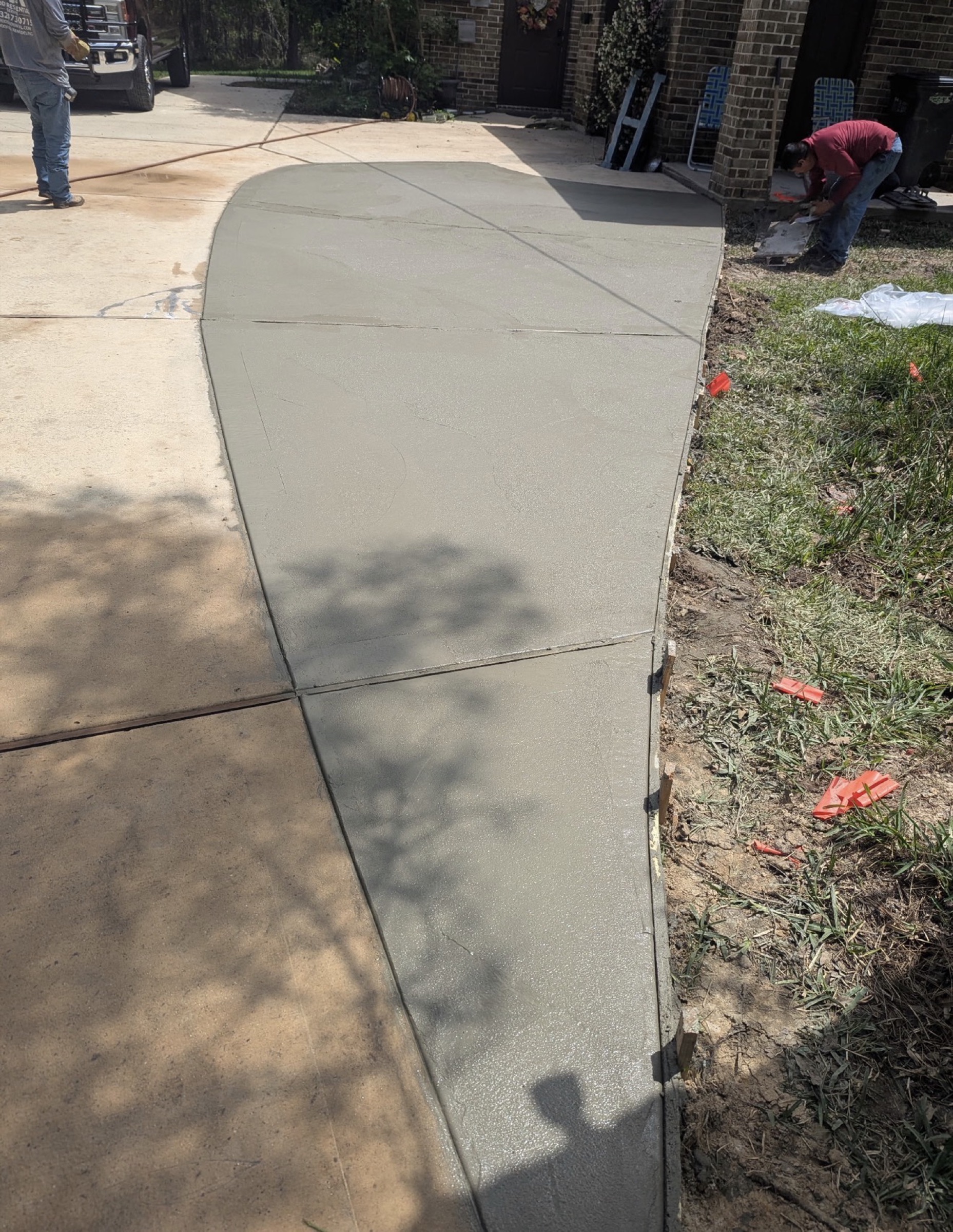 Walkway paving in progress on a Houston driveway