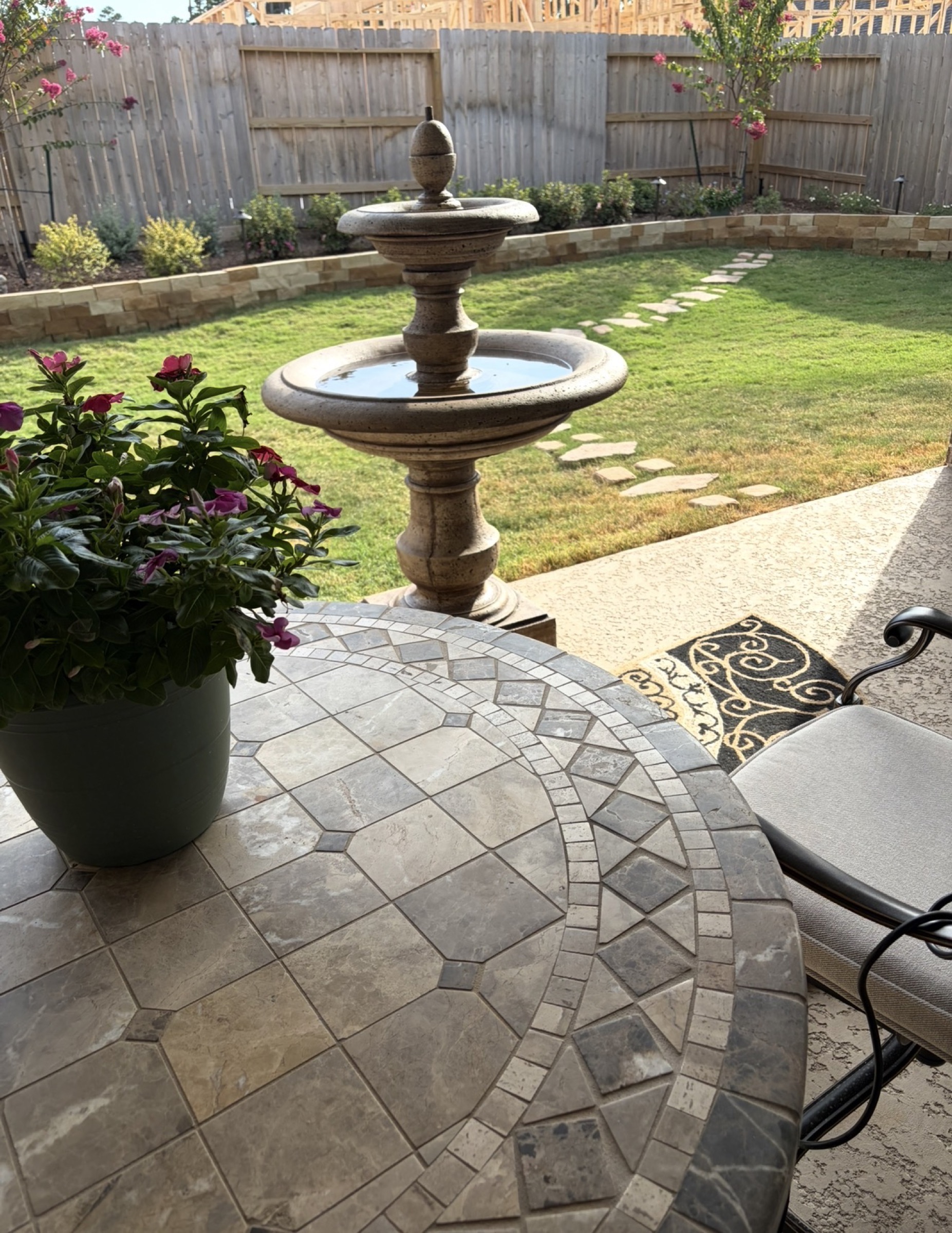 Fountain and limestone retaining wall on a Houston patio