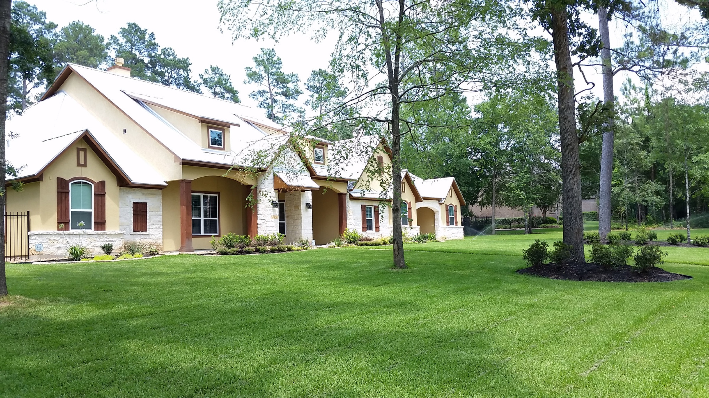 Established Houston lawn with irrigation covering the front